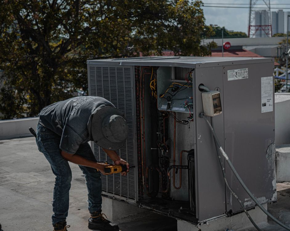 Start an HVAC business — technician working on residential HVAC system